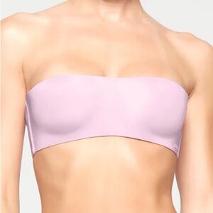 SKIMS Wireless Strapless Bra in baby pink